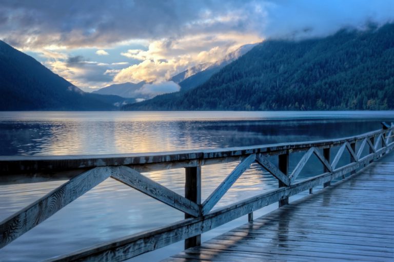 Sunset and clouds reflect off lake at Lake Crescent, Olympic National Park, Washington