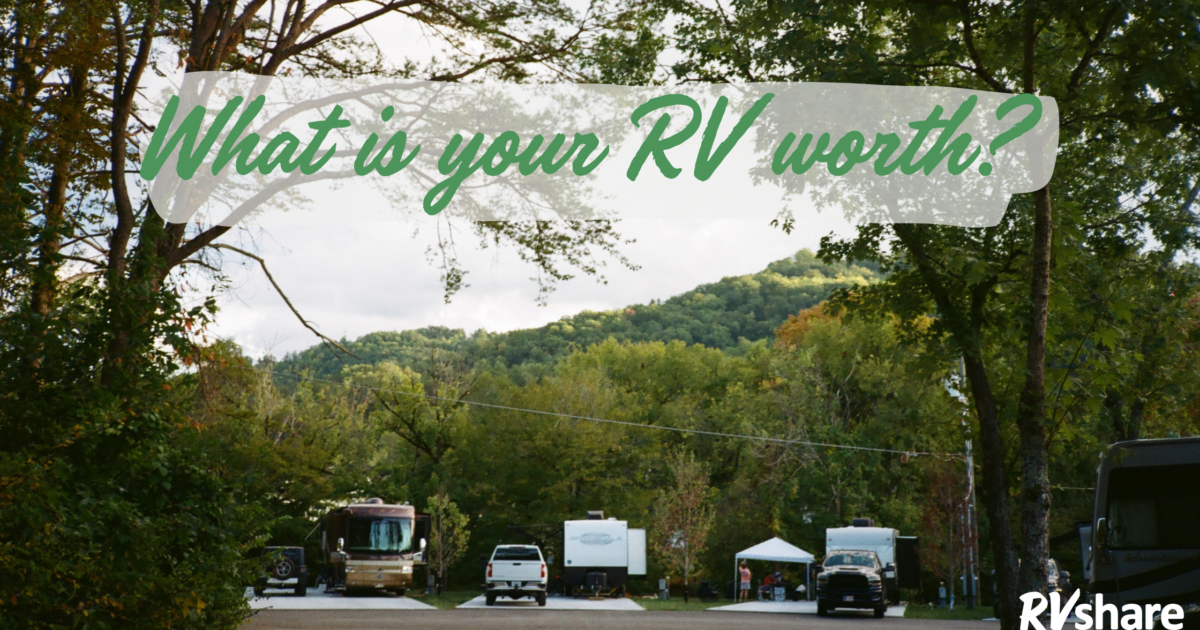 RVs at a campground with a banner that says "how much is your rv worth?"