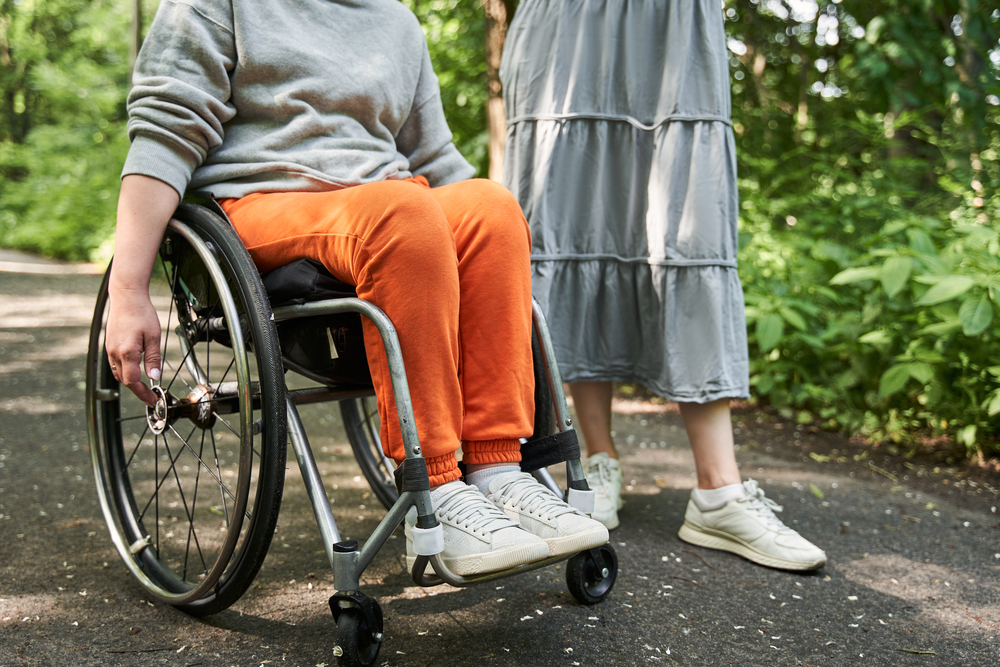 woman in wheelchair next to a friend