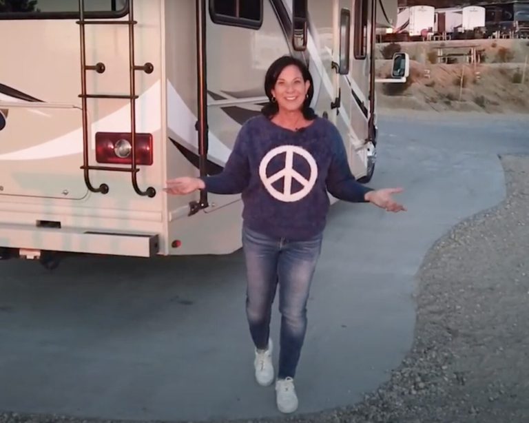 The Travel Mom stands in front of her RVshare rental