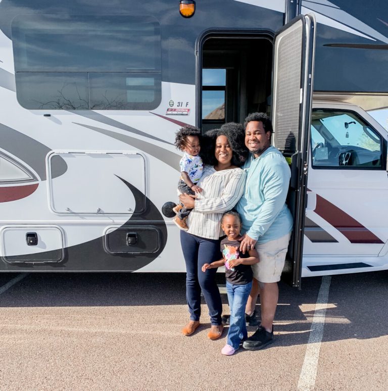 family standing in front of an RV