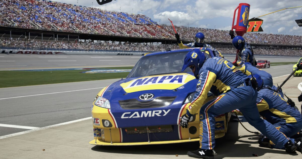 Race car making a pit stop at Talladega Speedway, one of the top Alabama landmarks