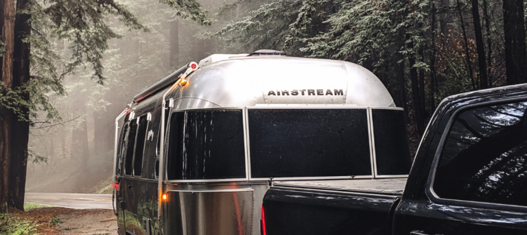 luxury airstream travel trailer in the woods