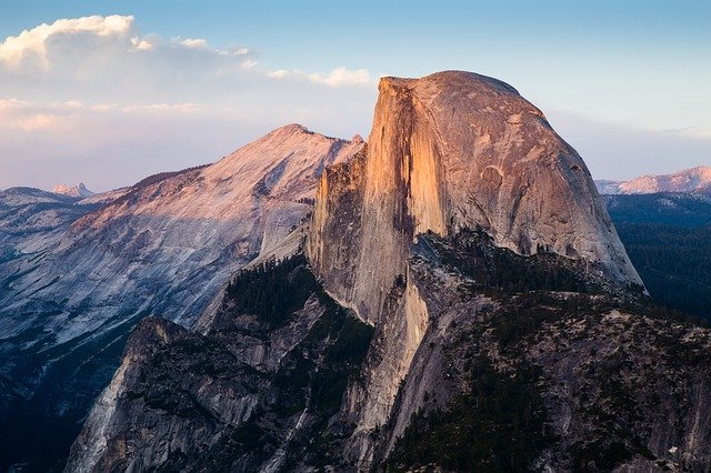 Half Dome at Yosemite as the setting sun hits the rock