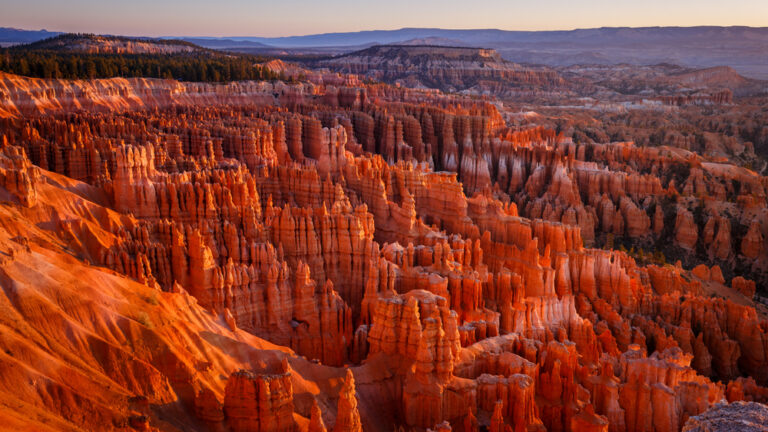 Inspiration Point during beautiful sunrise, with hoodoos - unique rock formations from sandstone made by geological erosion. Bryce National Park, Utah, USA