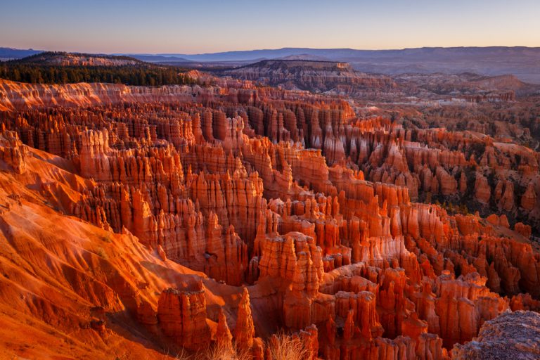 Inspiration Point during beautiful sunrise, with hoodoos - unique rock formations from sandstone made by geological erosion. Bryce National Park, Utah, USA