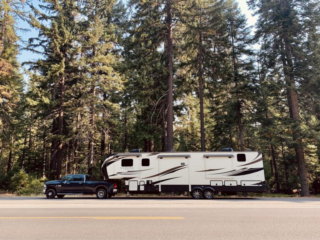 Parked fifth-wheel RV trailer attached to a truck