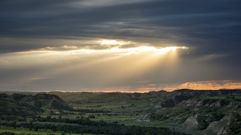 Sun shining down on landscape in Theodore Roosevelt National Park, something your might see while North Dakota boondocking