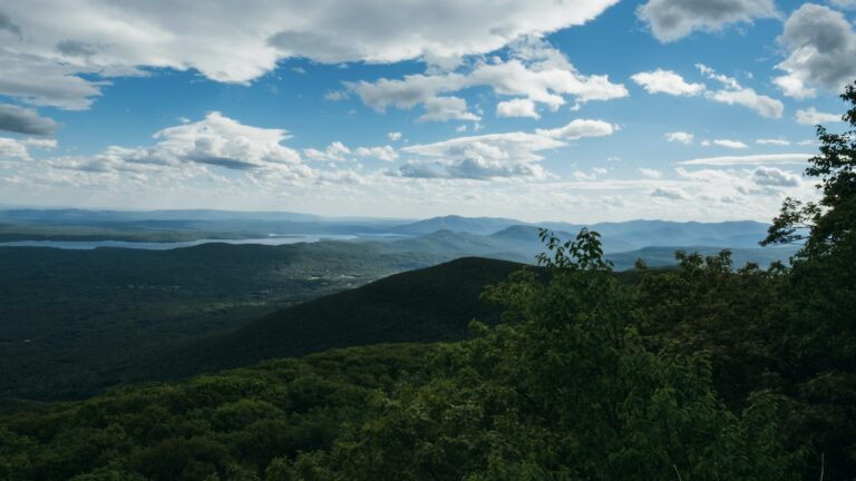 The Catskills mountains against a bright blue sky, something you might see while New York boondocking