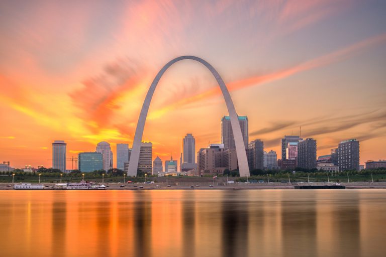 St. Louis, Missouri downtown cityscape on the river at dusk.