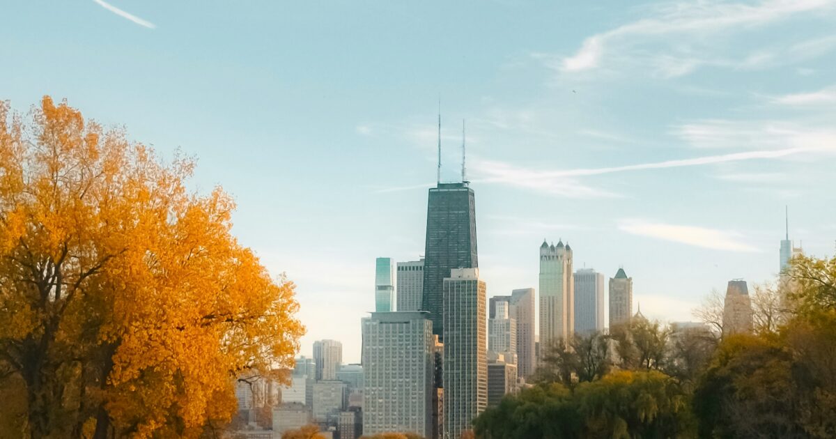 Fall foliage in Lincoln Park with the Chicago Skyline in the distance