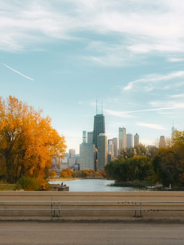 Fall foliage in Lincoln Park with the Chicago Skyline in the distance