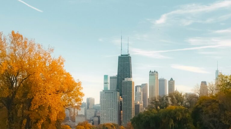 Fall foliage in Lincoln Park with the Chicago Skyline in the distance