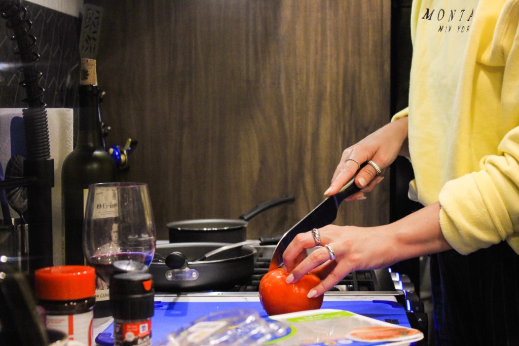 Person cooking a meal in their RV