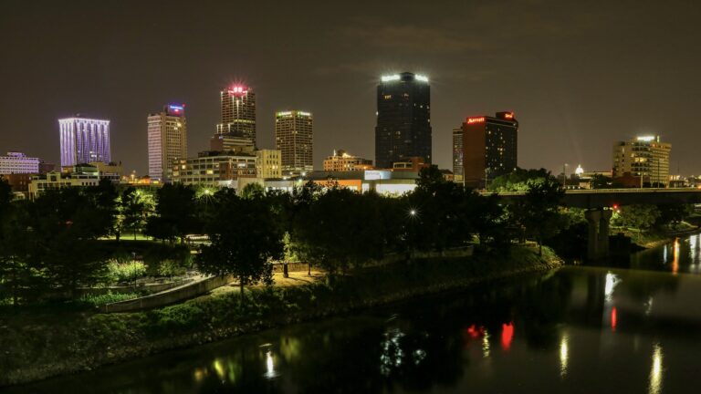 Nighttime view of Little Rock across water. This is the perfect place for Arkansas urban camping