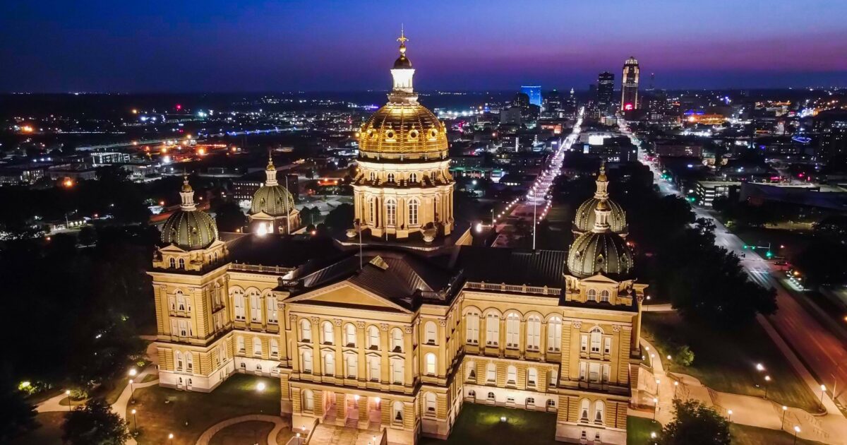 Nighttime view of the capitol building in Des Moines, one of the best places for urban camping in Iowa