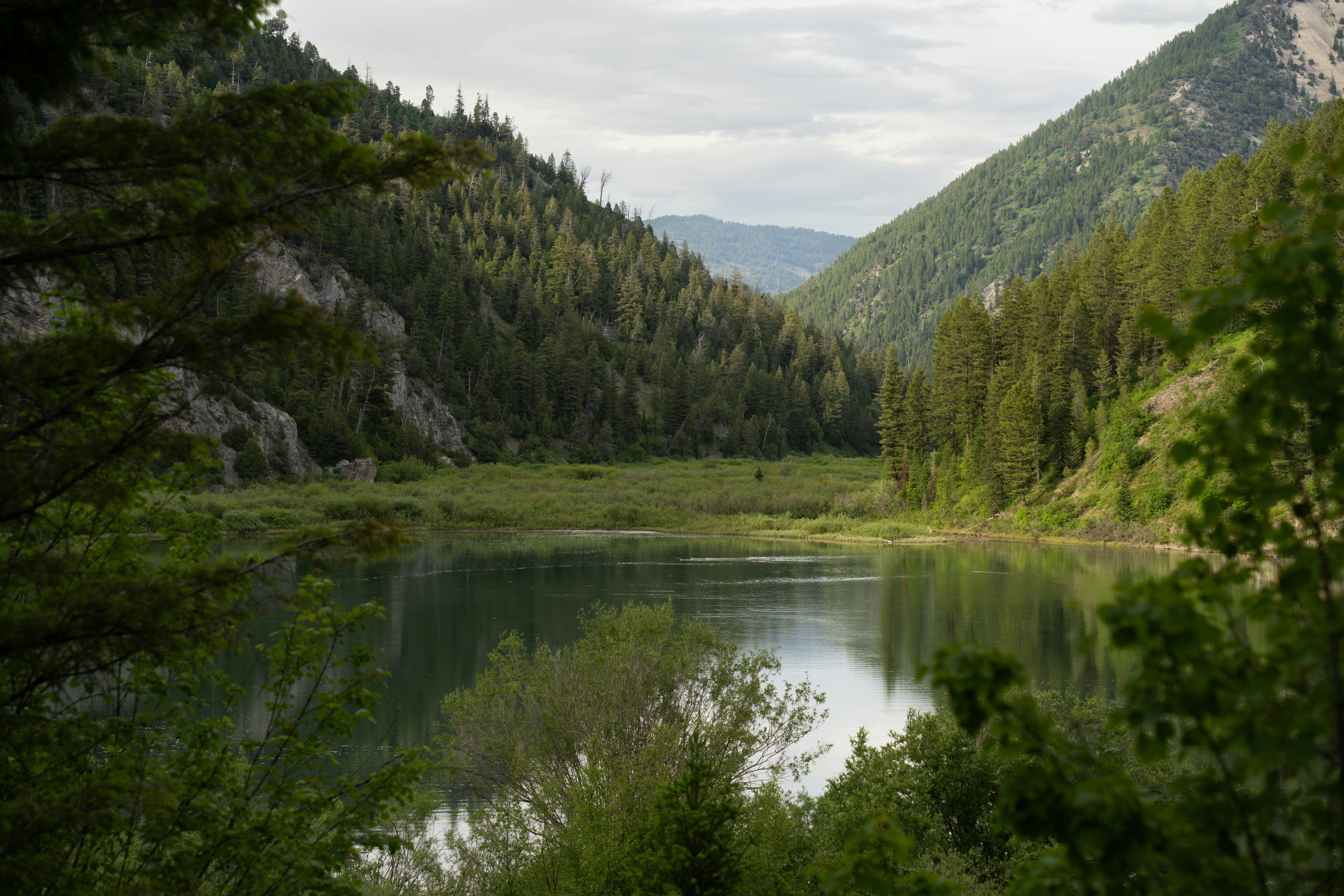 A lovely pond with mountains in the background, a view you might have while boondocking in Idaho