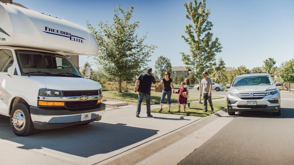 RV owner handing off RV rental to a family