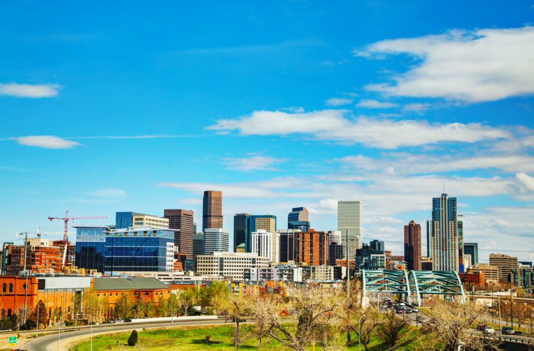 Downtown cityscape on a sunny day with wispy clouds in the sky