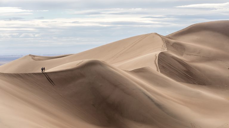 Couple hiking at Great Sand Dunes National Park, Colorado