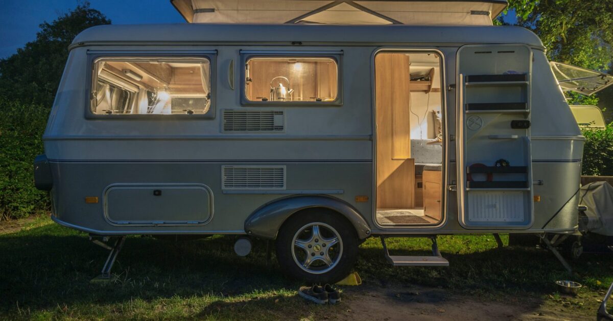 Small trailer parked with lights on