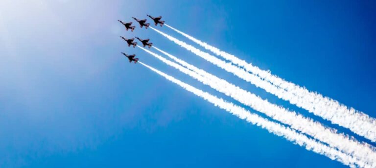 jets fly in formation at an air show