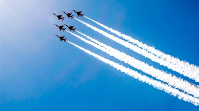 jets fly in formation at an air show