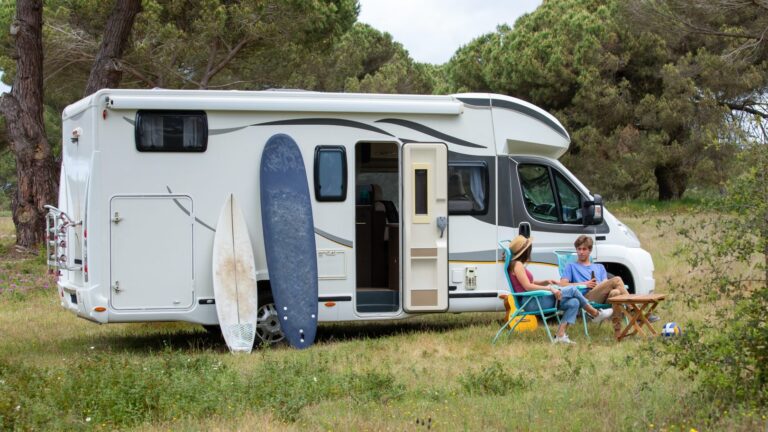 a camper with surfboard