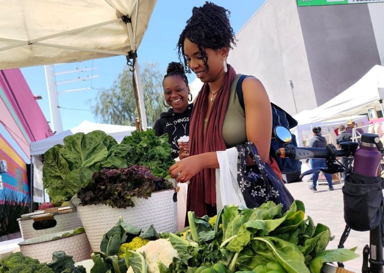 woman visiting a farmers market