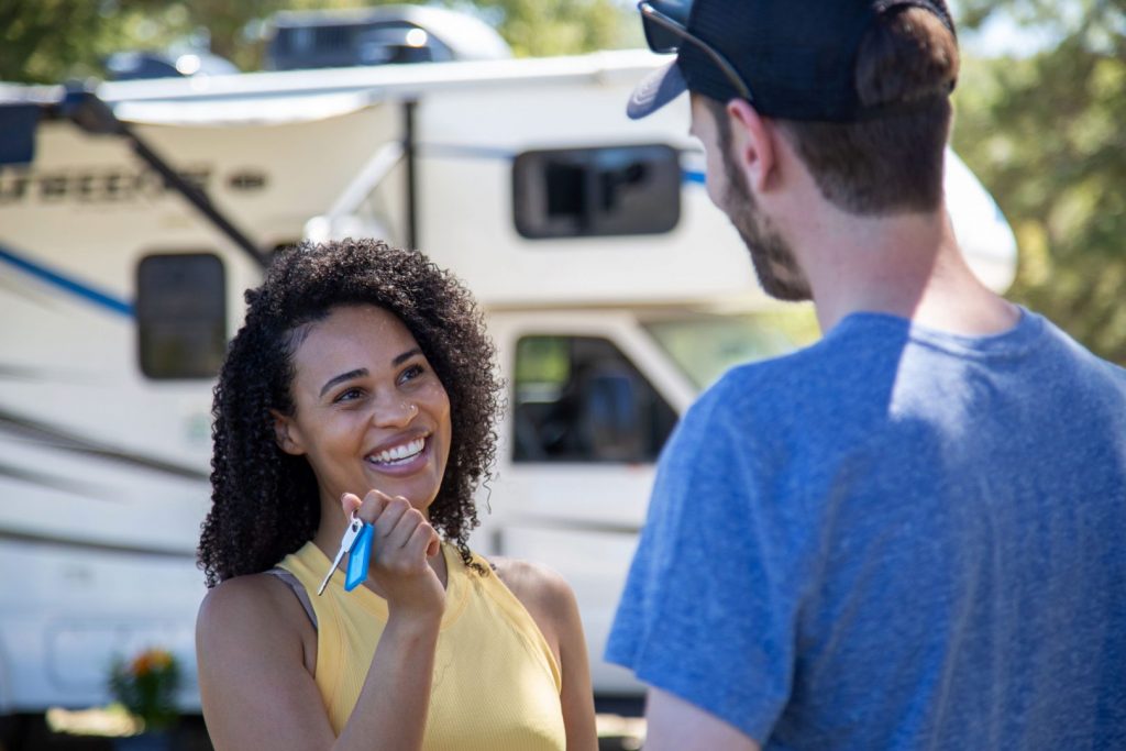 woman hands over the keys to her rv