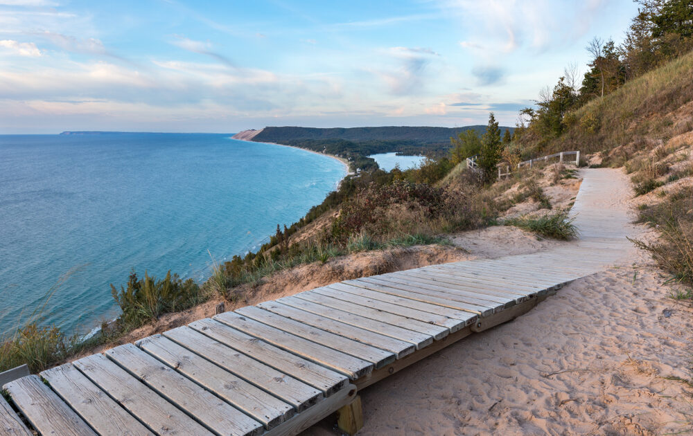 A weathered wooden walkway on the Empire Bluffs Trail is the perfect overlook to see Lake Michigan, the Sleeping Bear Dunes, and the Manitou island