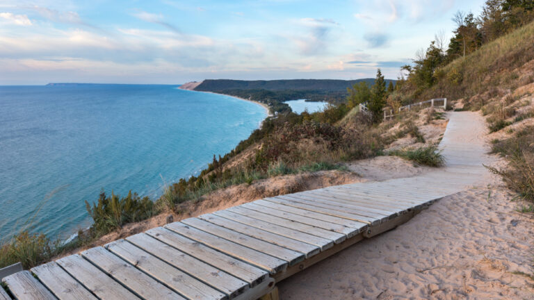 A weathered wooden walkway on the Empire Bluffs Trail is the perfect overlook to see Lake Michigan, the Sleeping Bear Dunes, and the Manitou island