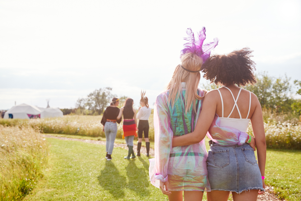 festival goers walk back to their camp