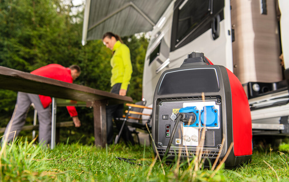 An RV generator with motorhome in the background