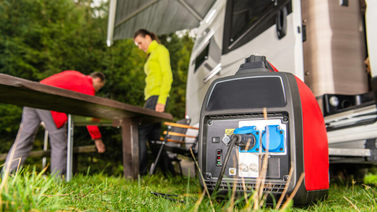 An RV generator with motorhome in the background