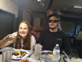 siblings enjoying a meal