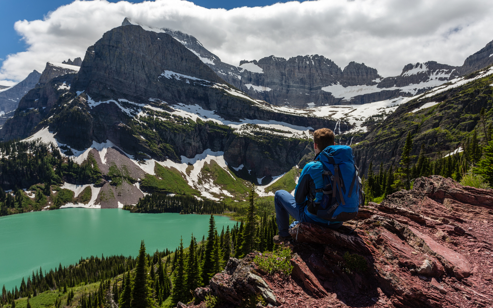 person overlooking mountains at glacier national park