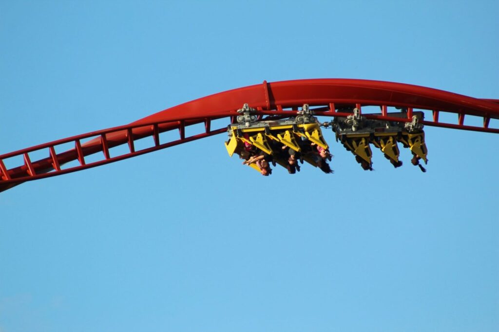 Adventure seekers on an upside-down roller coaster