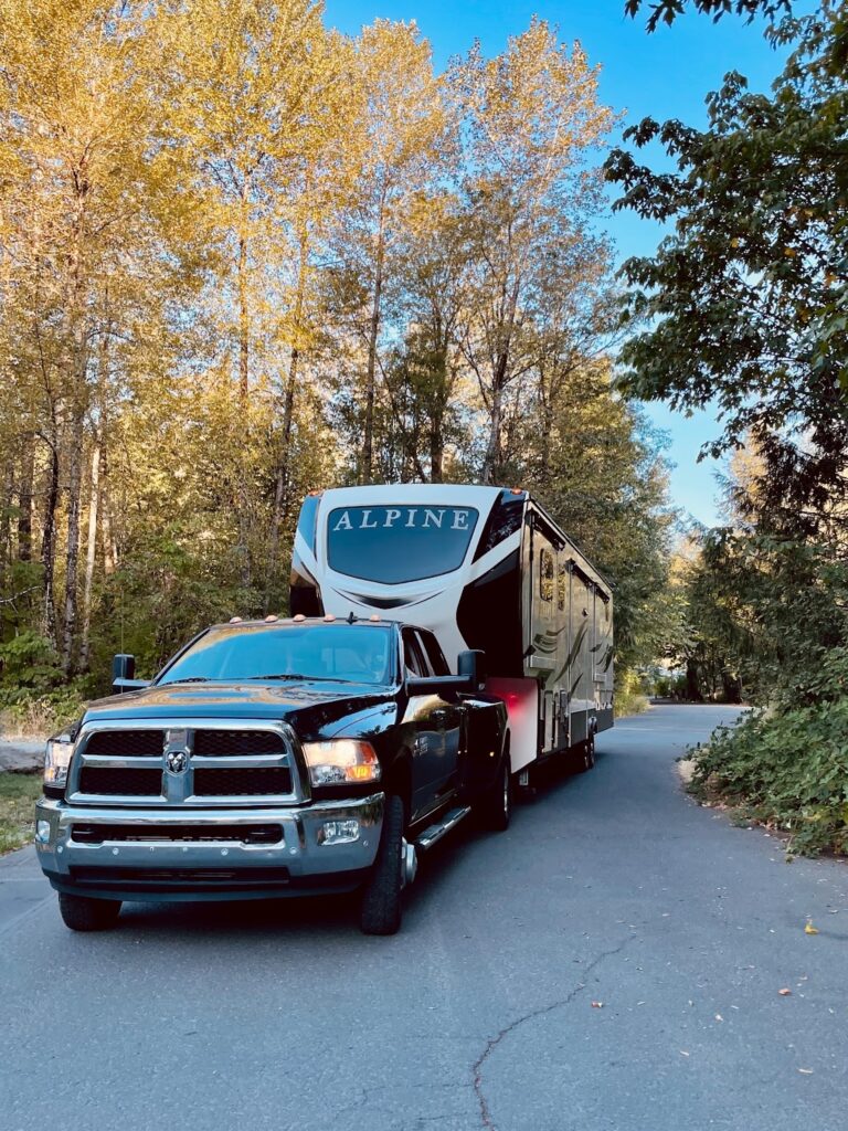 Parked fifth wheel trailer and truck