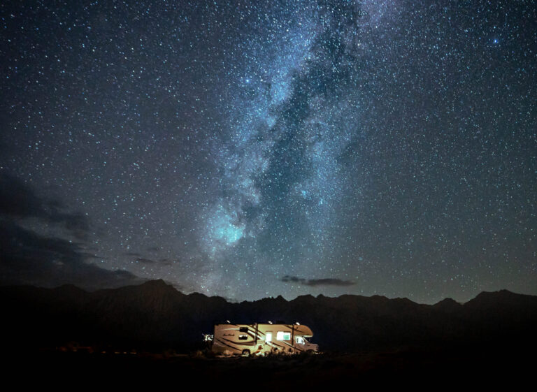 An RV with a dark sky