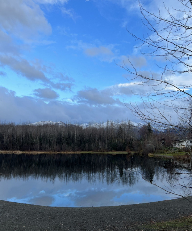 Cheney Lake with snow-capped mountains in the background