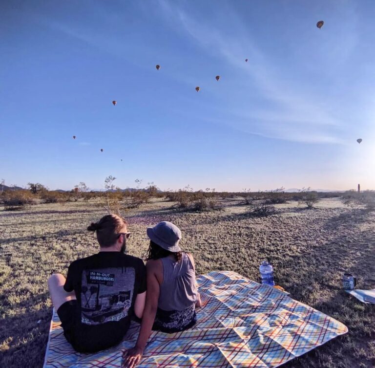 rv couple in desert