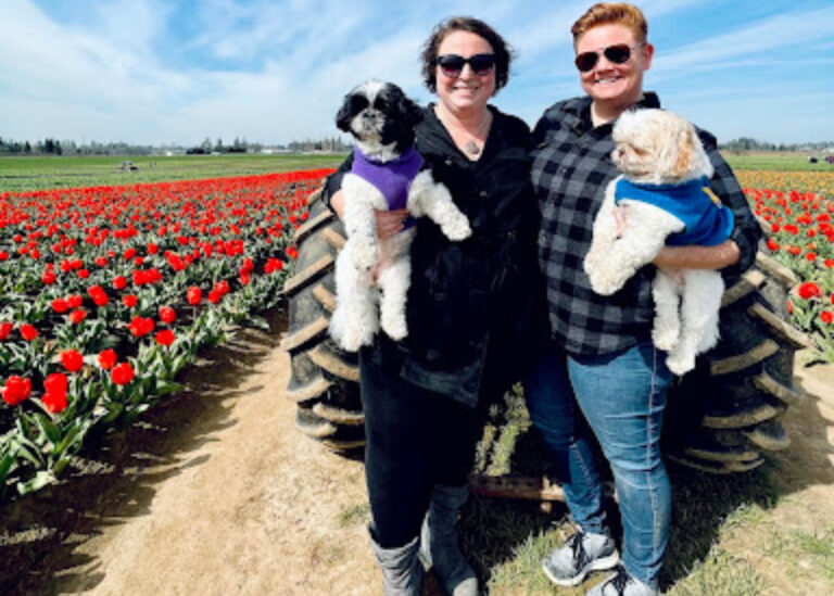 oregon couple with dogs in the tulip festival