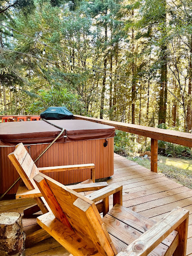 exterior of unique accommodations, jacuzzi and balcony overlooking lake