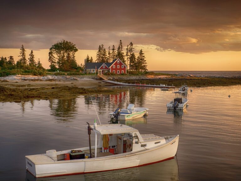 Beautiful view of a boat on the water while RV camping in Maine