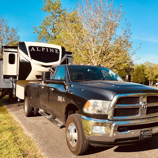 fifth wheel being towed by a truck