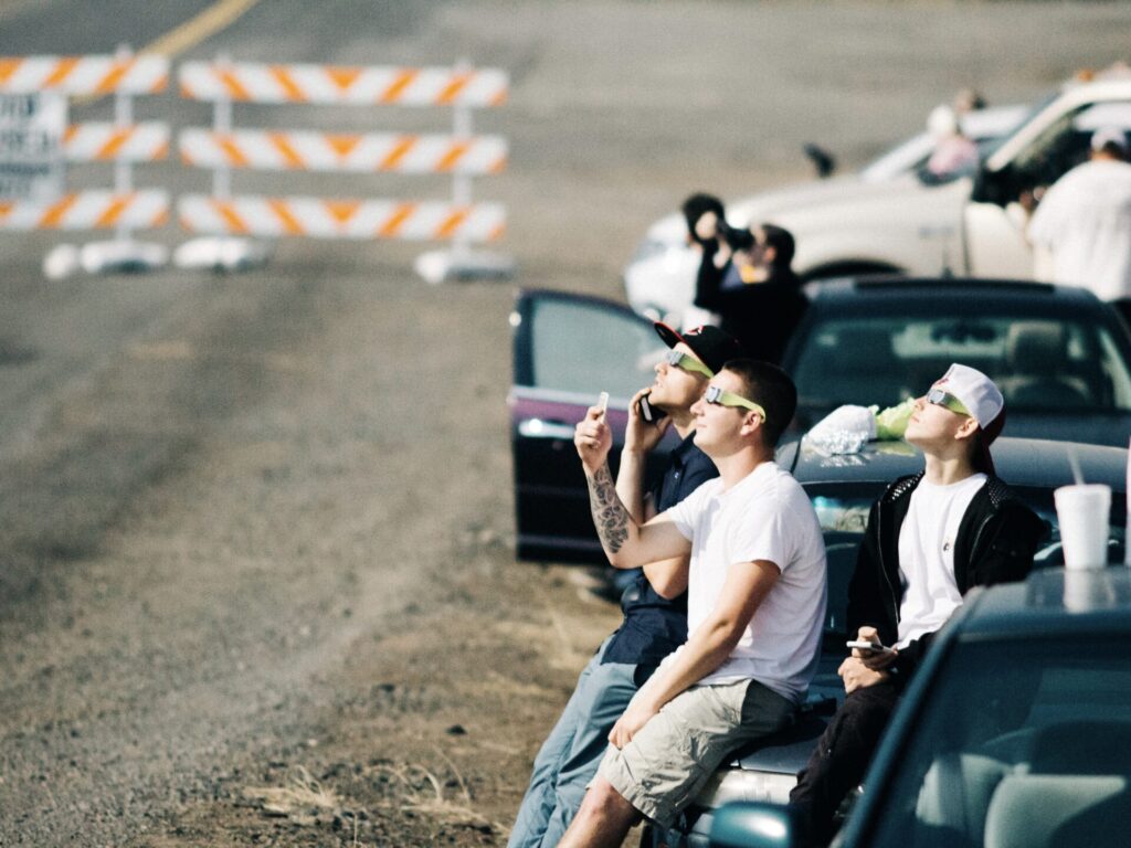 Group of people watching solar eclipse