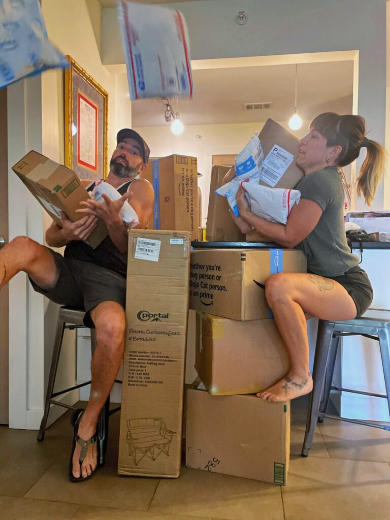 couple holding mail packages