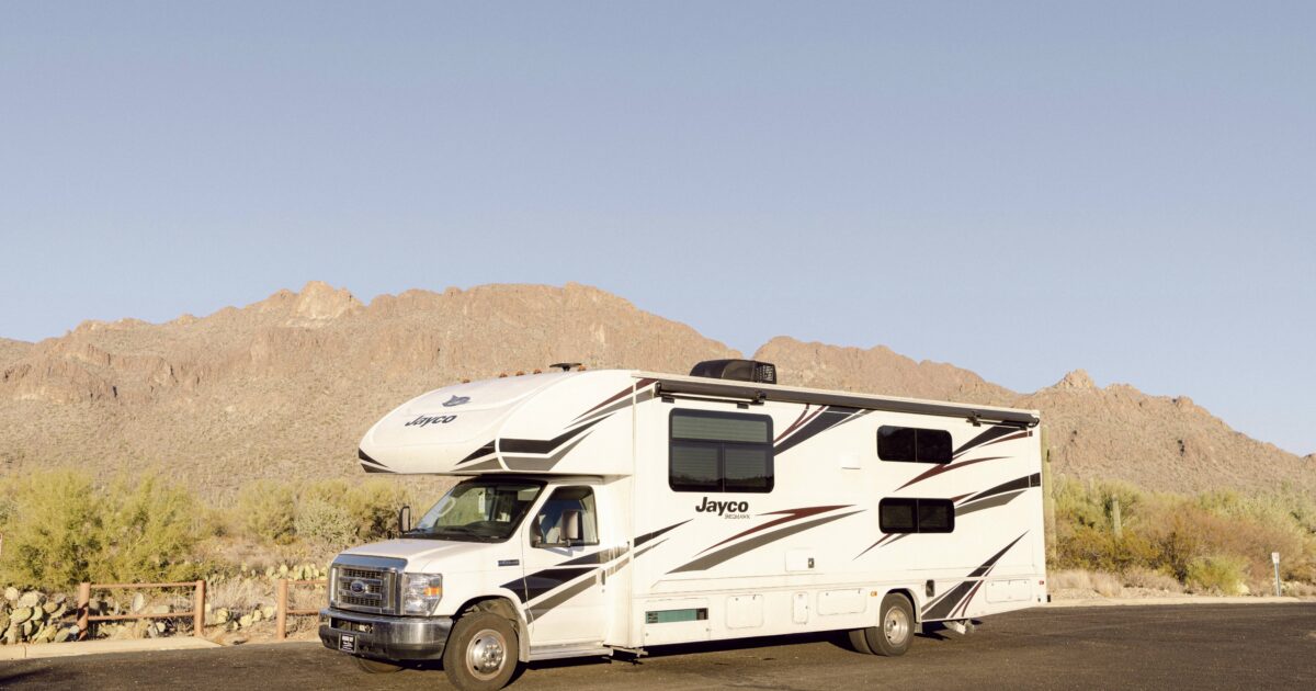 RV parked alone in the desert - Chloe Brennan