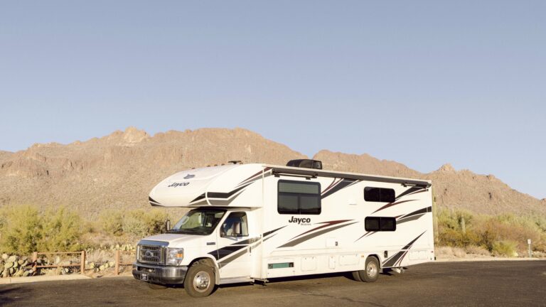 RV parked alone in the desert - Chloe Brennan